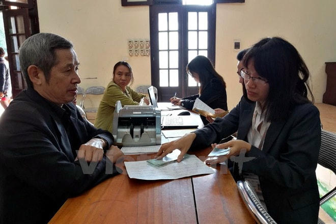 Chi trả lương hưu cho người lao động động. (Ảnh minh họa: PV/Vietnam+) huu.jpg
