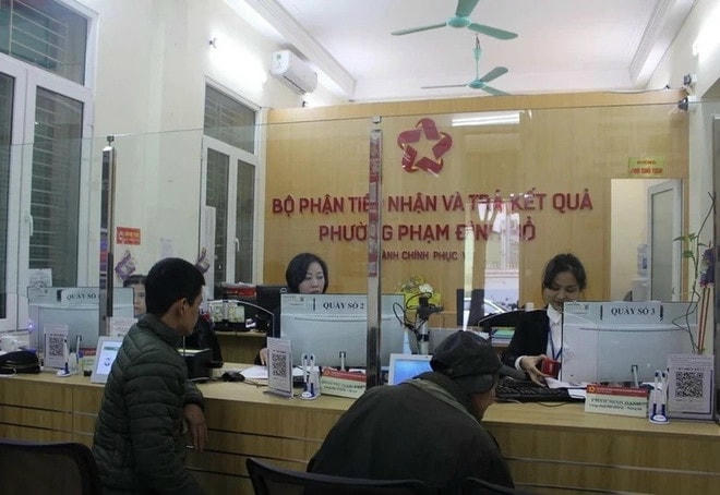 Bộ phận một cửa tại Ủy ban Nhân dân phường Phạm Đình Hổ (Hà Nội). (Ảnh: Nguyễn Thắng/TTXVN) tinh-gon-bo-may-2912.jpg