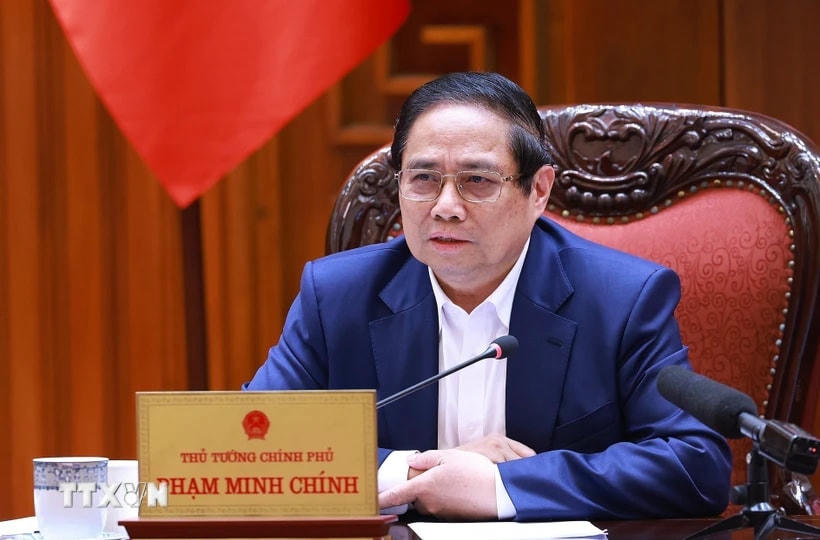 Thủ tướng Phạm Minh Chính chủ trì họp triển khai kế hoạch phân cấp, phân quyền khi thực hiện mô hình tổ chức chính quyền địa phương 2 cấp. (Ảnh: Dương Giang/TTXVN)