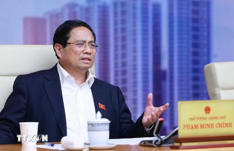 Thủ tướng Phạm Minh Chính chủ trì cuộc làm việc của Thường trực Chính phủ về tình hình thị trường bất động sản. (Ảnh: Dương Giang/TTXVN)