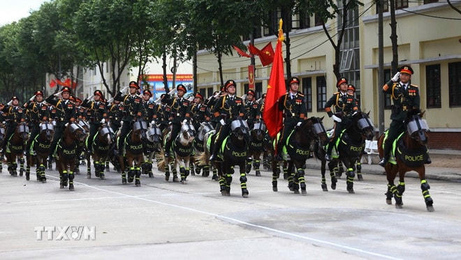 Khối kỵ binh của Cảnh sát cơ động tham gia hợp luyện. (Ảnh: Lê Xuân/TTXVN) ttxvn-ky-binh-3.jpg