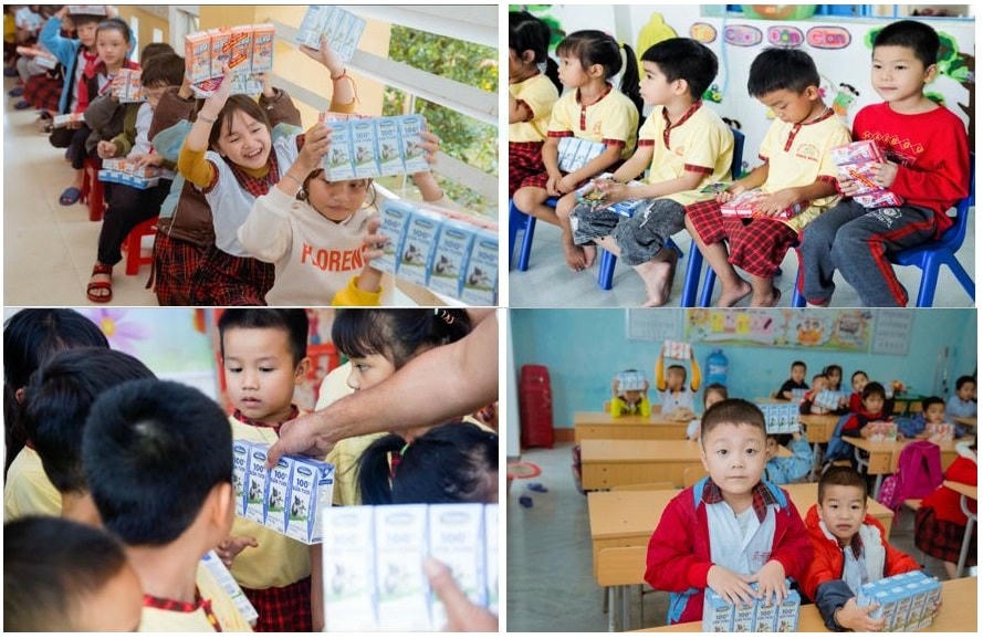 Các em học sinh tại Quảng Nam và Huế vui mừng khi nhận sữa Vinamilk từ đoàn hỗ trợ.