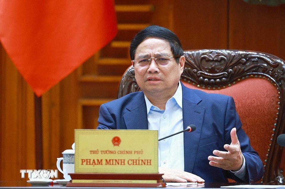 Thủ tướng Phạm Minh Chính chủ trì cuộc họp về mức áp thuế mới của Hoa Kỳ đối với hàng hoá nhập khẩu từ Việt Nam. (Ảnh: Dương Giang/TTXVN)