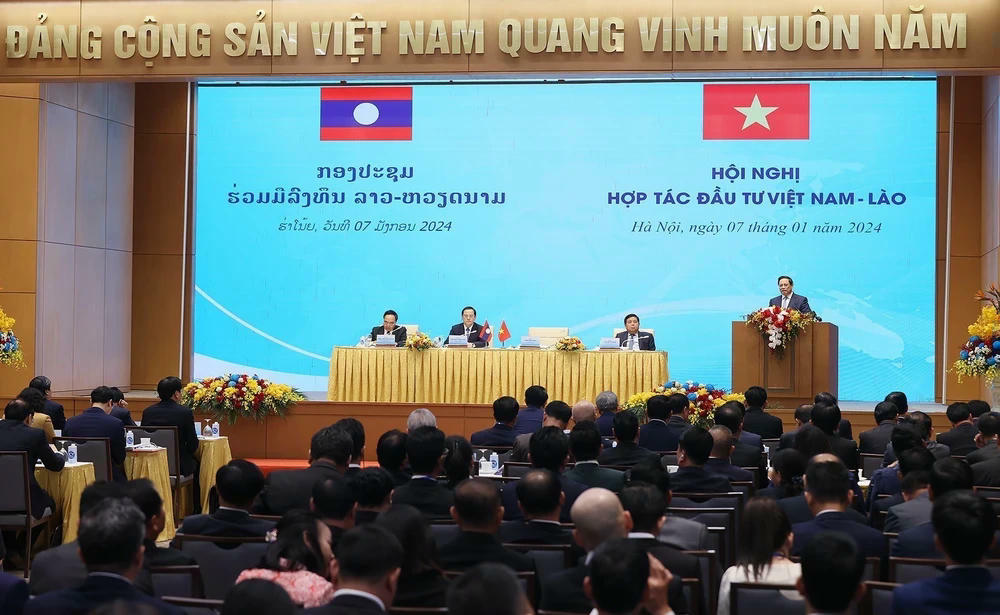 ttxvn-thu-tuong-pham-minh-chinh-va-thu-tuong-lao-sonexay-siphandone-du-hoi-nghi-hop-tac-dau-tu-viet-nam-lao-9-2767.jpg