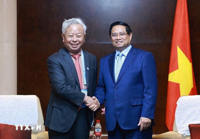 Thủ tướng Phạm Minh Chính tiếp ông Kim Lập Quần, Chủ tịch Ngân hàng Đầu tư cơ sở hạ tầng châu Á (AIIB). (Ảnh: Dương Giang/TTXVN) ttxvn-thu-tuong-tiep-mot-so-lanh-dao-tap-doan-hang-dau-cua-trung-quoc-9.jpg