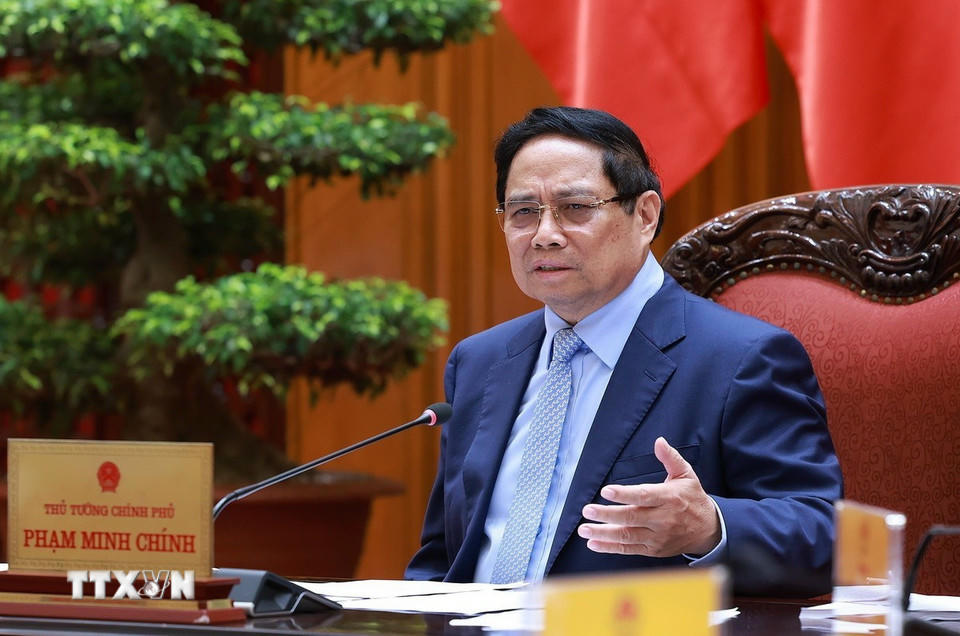Thủ tướng Phạm Minh Chính chủ trì cuộc họp về triển khai đẩy nhanh tiến độ thực hiện các dự án đường sắt kết nối Việt-Trung. (Ảnh: Dương Giang/TTXVN)