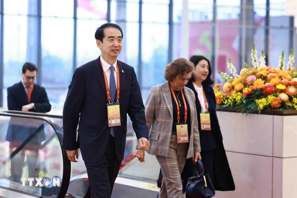 Các đại biểu quốc tế đến dự phiên khai mạc Đại hội XIV của Đảng. (Nguồn: TTXVN)