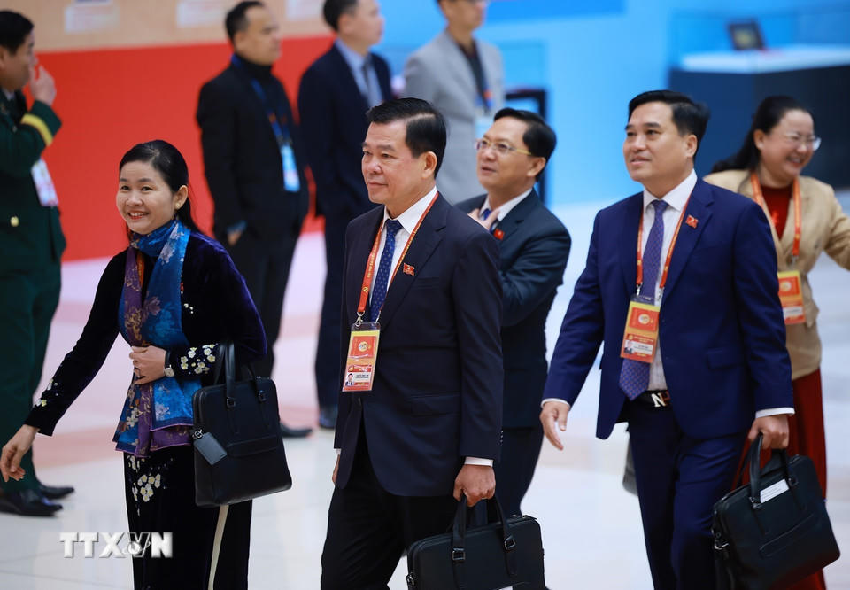 Các đại biểu đến dự ngày làm việc thứ tư Đại hội XIV của Đảng, sáng 22/1. (Ảnh: TTXVN). 