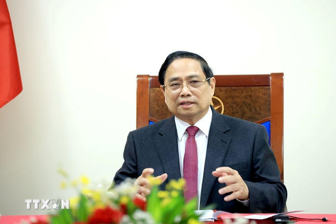 Thủ tướng Phạm Minh Chính điện đàm với Thủ tướng Singapore Lawrence Wong. (Ảnh: Tuấn Anh/TTXVN).