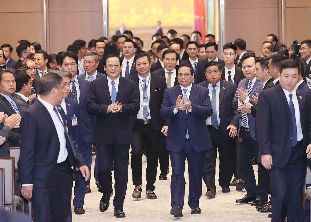 ttxvn-thu-tuong-pham-minh-chinh-va-thu-tuong-lao-sonexay-siphandone-du-hoi-nghi-hop-tac-dau-tu-viet-nam-lao-1-1344.jpg