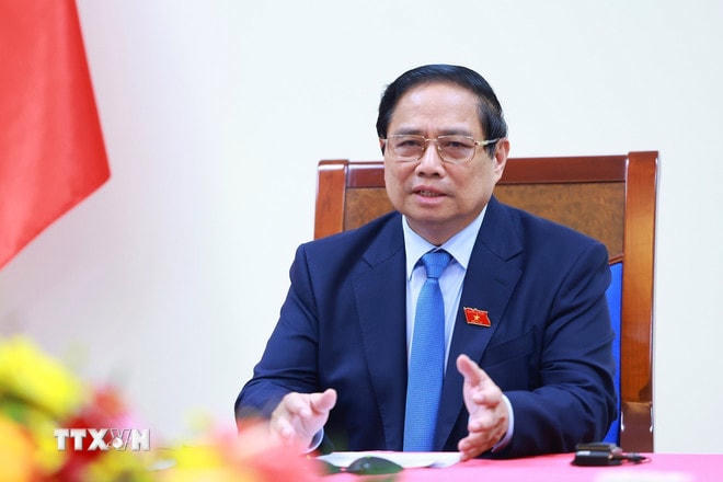 ttxvn-thu-tuong-pham-minh-chinh-dien-dam-voi-thu-tuong-singapore-2.jpg