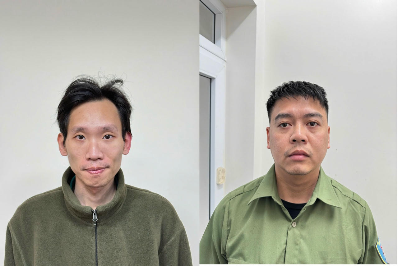 2 bảo vệ của Công ty kho vận cảng Cẩm Phả (từ trái qua phải) Nguyễn Thế Anh và Nguyễn Quốc Việt